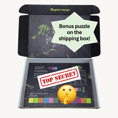 Open box with a bonus puzzle and 'Top Secret' stamp, featuring Vegout Voyage branding.