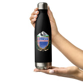 Black water bottle with a mountain and flag design held by a hand on a white background