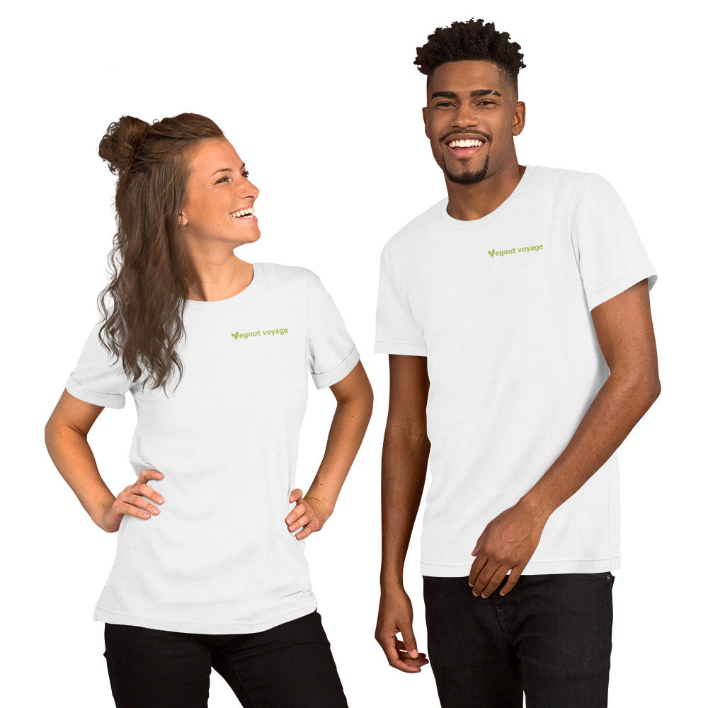 Man and woman wearing white Vegout Voyage logo unisex t-shirts